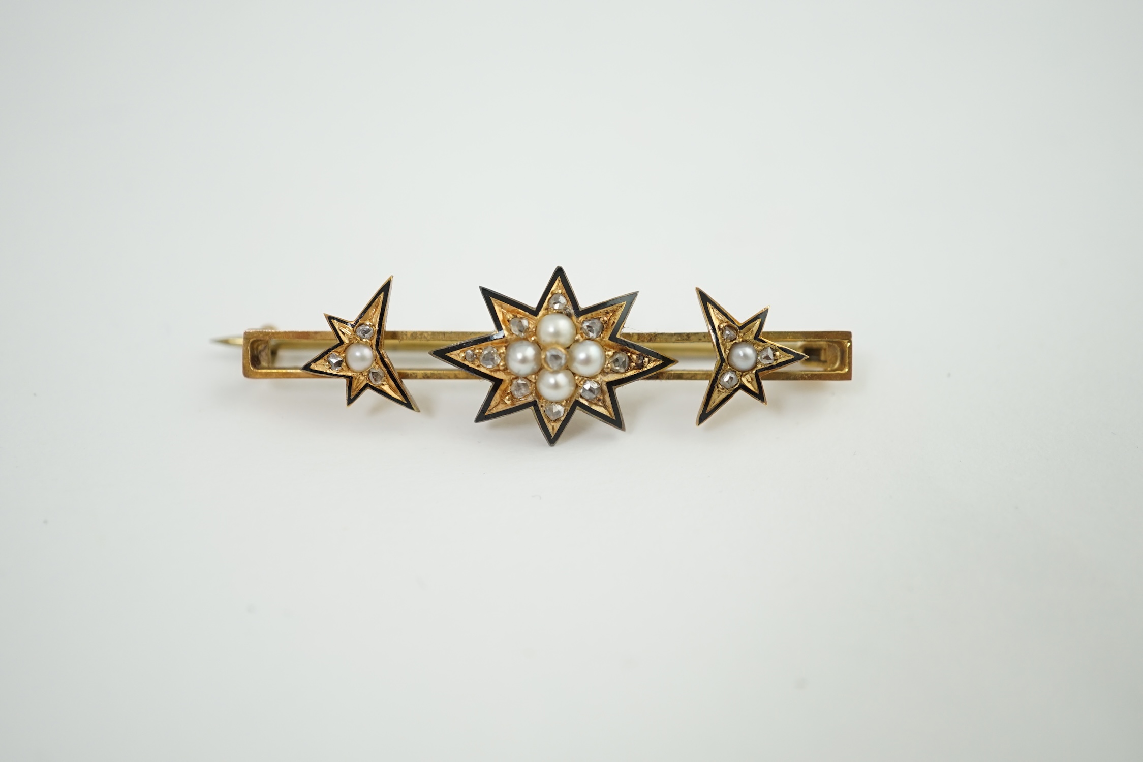 A cased Victorian gold, enamel, rose cut diamond and split pearl set bar brooch